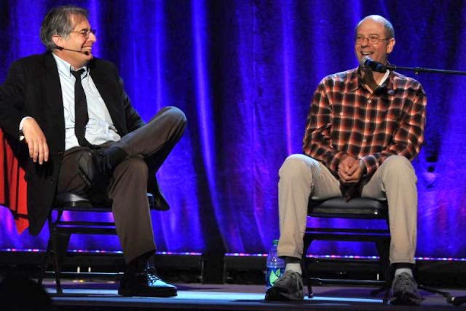 caption: Stephen Tobolowsky and KUOW's Steve Scher on stage at Seattle's Neptune Theater during Weekday Live.