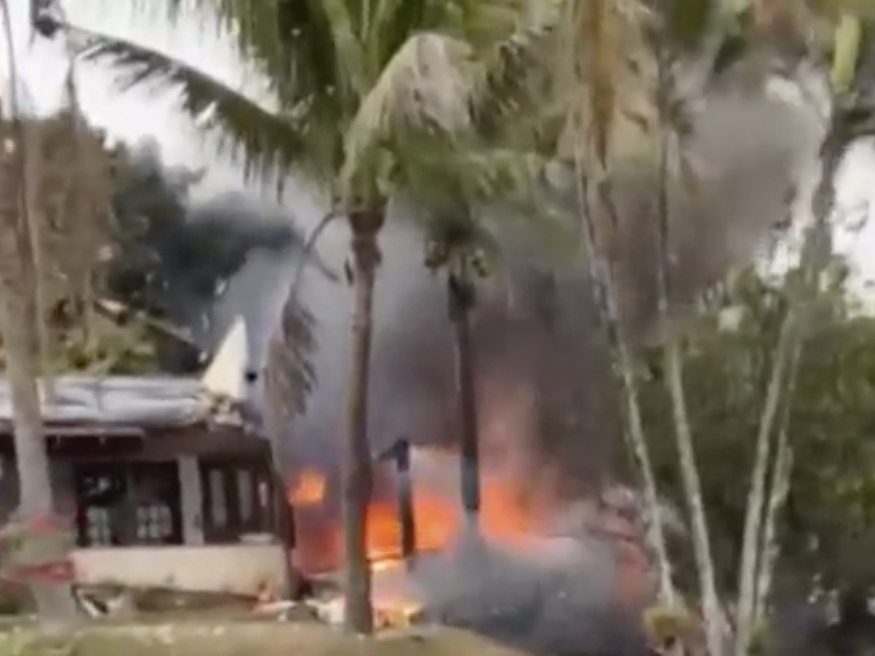 caption: This frame grab from a video shows fire coming from a plane that crashed by a home in Vinhedo, Sao Paulo state, Brazil, Friday.