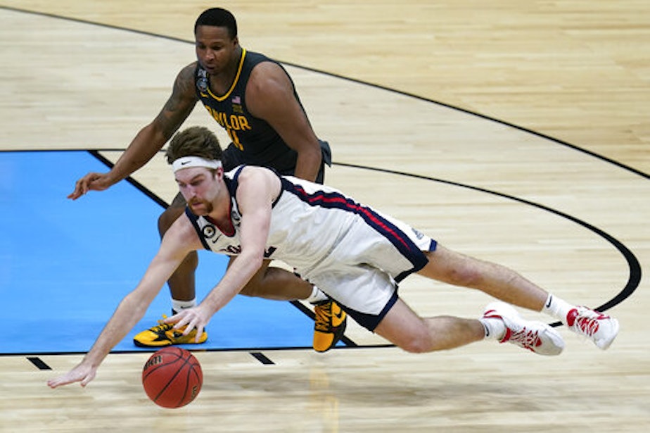caption: Gonzaga forward Drew Timme loses control of the ball ahead of Baylor guard Mark Vital, rear, during the second half of the championship game in the men's Final Four NCAA college basketball tournament, Monday, April 5, 2021, at Lucas Oil Stadium in Indianapolis. 