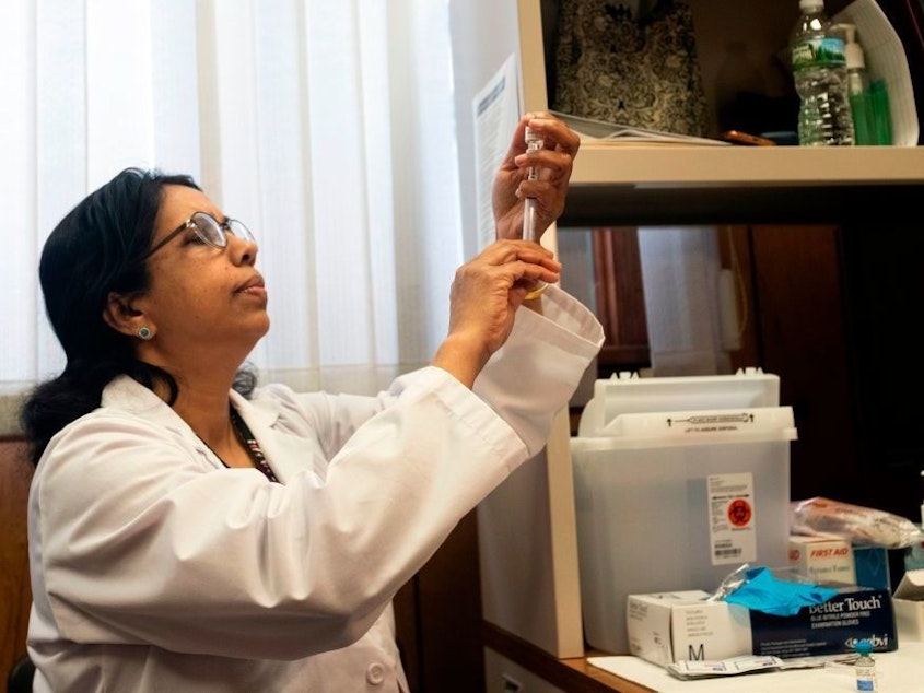 caption: A nurse prepares the measles, mumps and rubella vaccine at the Rockland County Health Department in Haverstraw, N.Y. Several measles outbreaks in New York state are contributing to this year's unusually high measles rates.