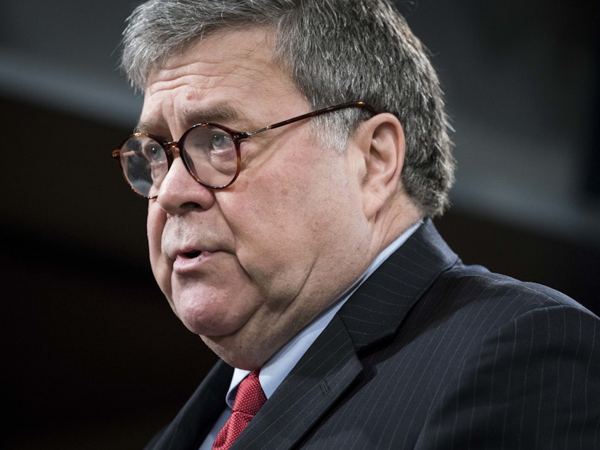 caption: Attorney General William Barr, pictured during a news conference on Monday, tells ABC News that President Trump should stop his commentary about ongoing Justice Department cases.