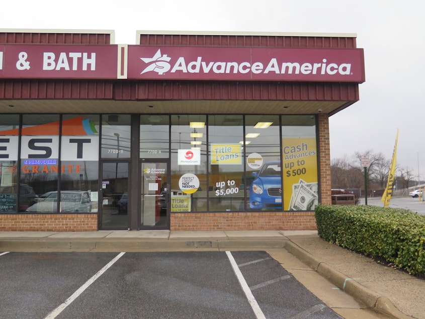 caption: Ads promise cash in the form of payday loans at an Advance America storefront in Springfield, Va. The Consumer Financial Protection Bureau is seeking to rescind a proposed rule to safeguard borrowers from payday lenders. CREDIT: DANIELLA CHESLOW/NPR