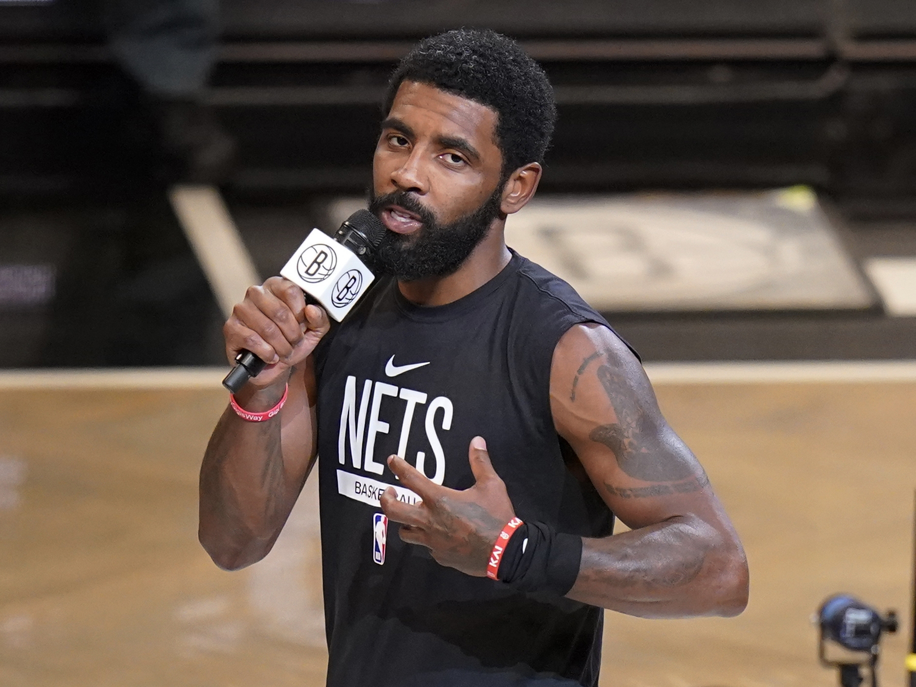 caption: Brooklyn Nets' Kyrie Irving speaks before the team's NBA basketball game against the New Orleans Pelicans on Oct. 19, 2022, in New York. The Nets are suspending Irving for at least five games without pay, saying they were dismayed by his failure to "unequivocally say he has no antisemitic beliefs."