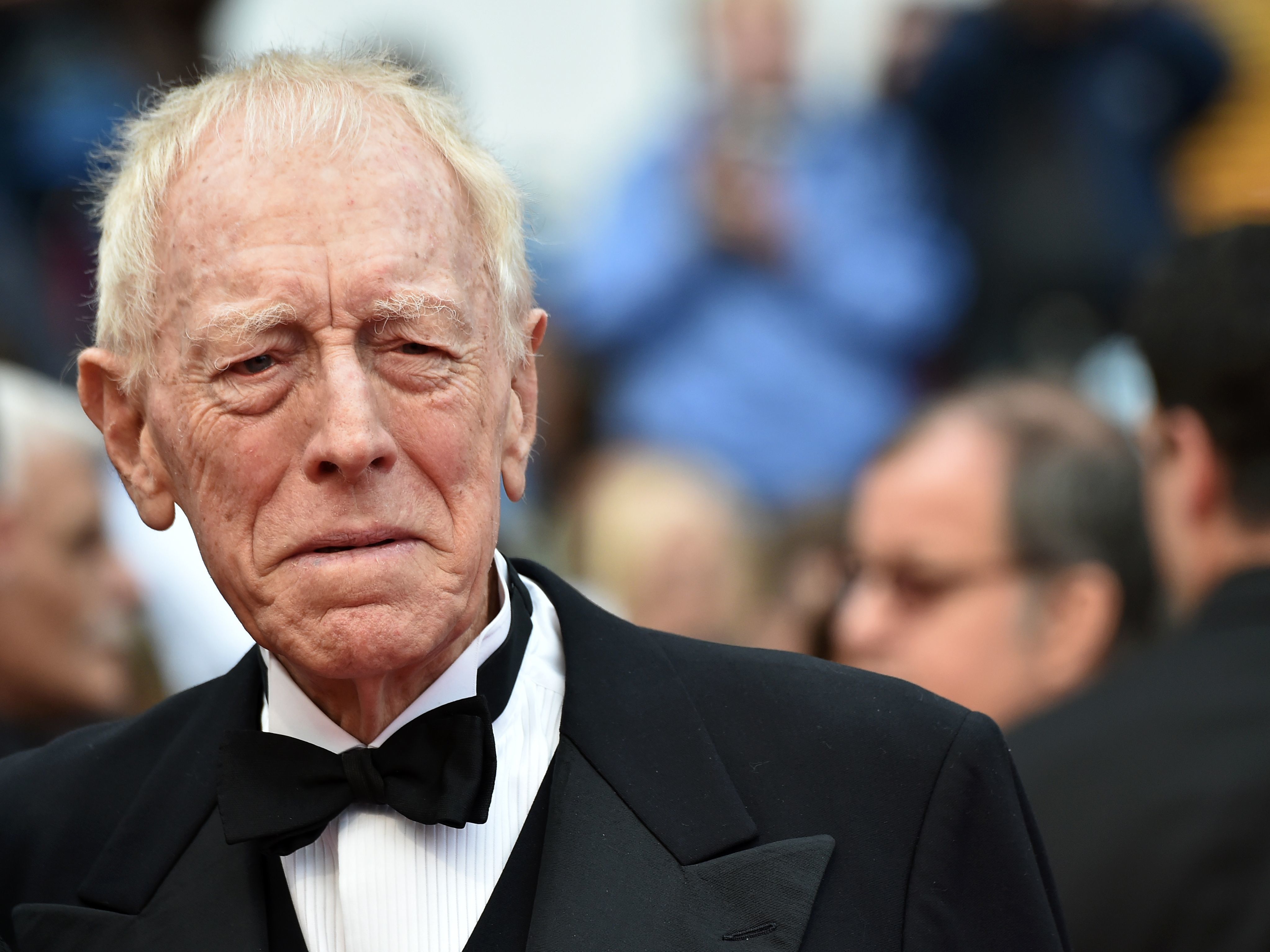 caption: Max von Sydow's deep voice and stern aspect often led to him being cast in severe roles. He's pictured here at the 2016 Cannes Film Festival.