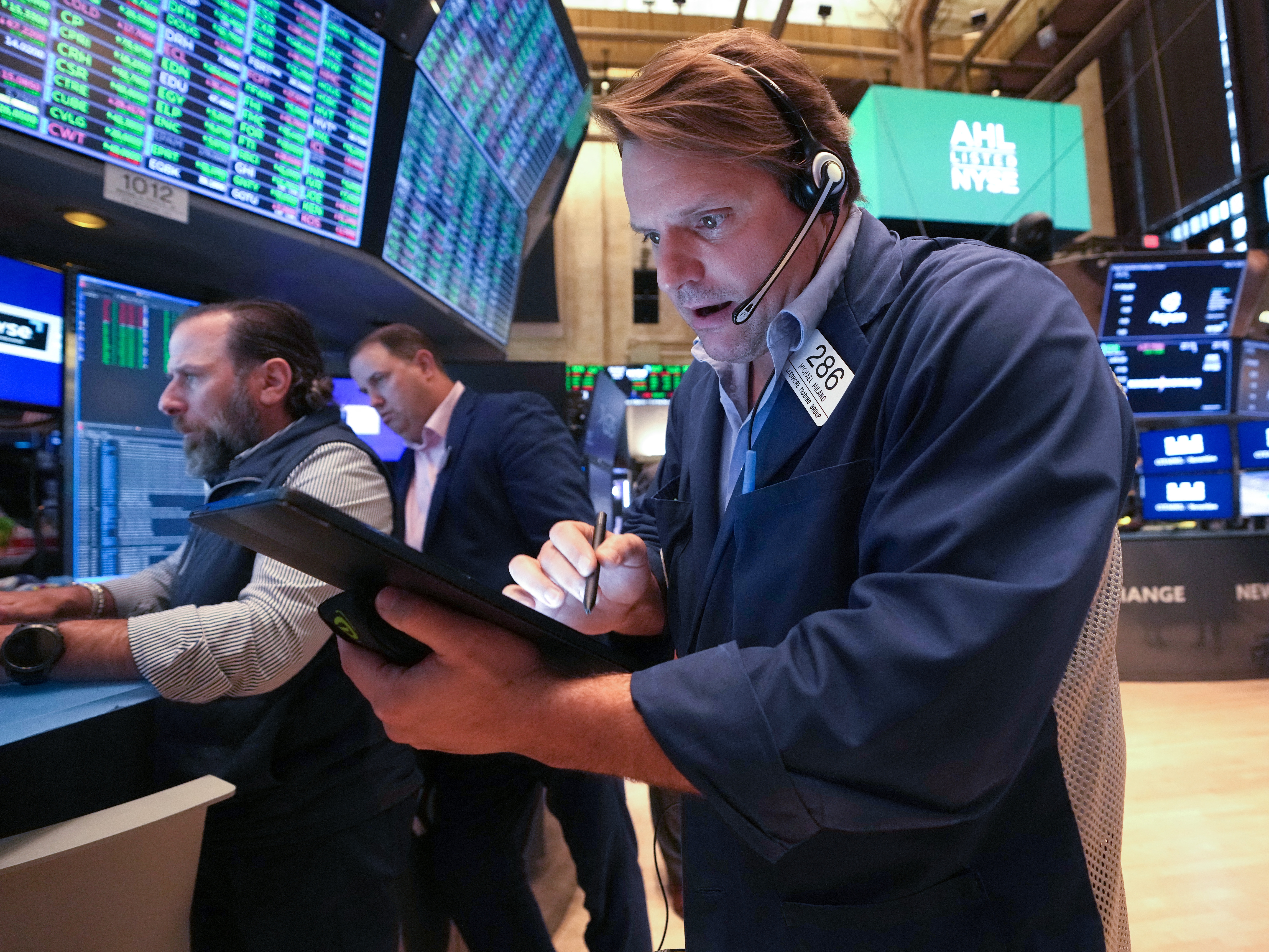 caption: Traders work on the floor of the New York Stock Exchange (NYSE) at the opening bell on May 8, 2025, in New York City. Stocks surged on Monday after China and the U.S. clinched a temporary deal on tariffs.