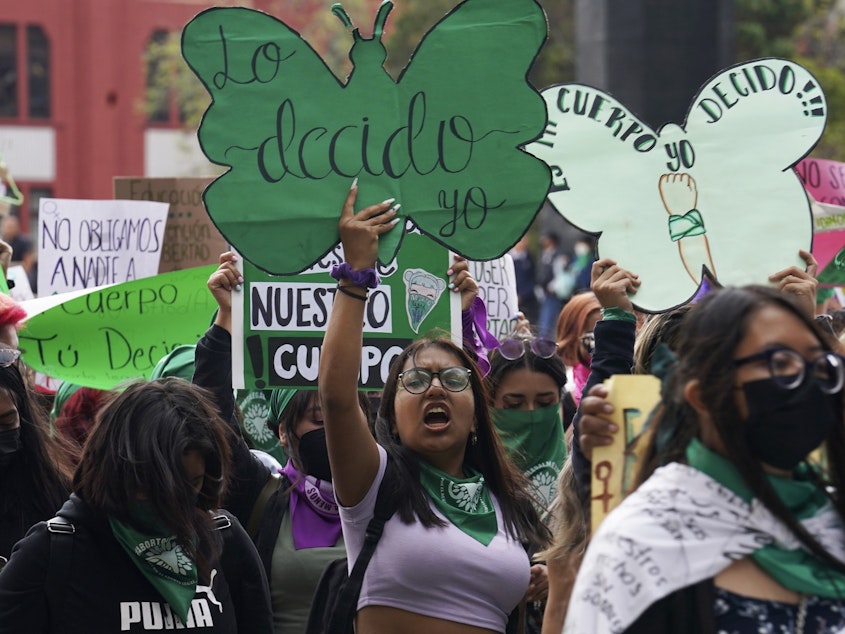 caption: A woman holds up a sign with a message that reads in Spanish; "I will decide" as she joins a march demanding legal, free and safe abortions for all women, marking International Safe Abortion Day, in Mexico City, Sept. 28, 2022. Mexico's Supreme Court on Wednesday, Sept. 6, 2023, has decriminalized abortion nationwide.