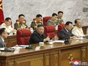 caption: In this photo provided by the North Korean government, North Korean leader Kim Jong Un, center, speaks during a Workers' Party meeting Thursday in Pyongyang. Kim ordered his government to be fully prepared for confrontation with the Biden administration, state media reported Friday, days after the U.S. and other major powers urged the North to abandon its nuclear program and return to talks.