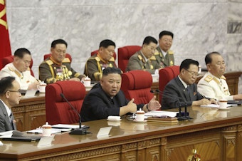 caption: In this photo provided by the North Korean government, North Korean leader Kim Jong Un, center, speaks during a Workers' Party meeting Thursday in Pyongyang. Kim ordered his government to be fully prepared for confrontation with the Biden administration, state media reported Friday, days after the U.S. and other major powers urged the North to abandon its nuclear program and return to talks.