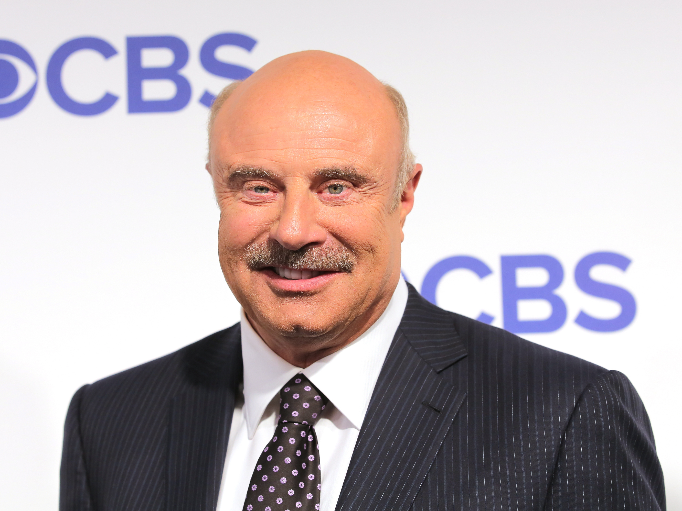 caption: Phil McGraw, pictured here at a 2016 premiere, plans to end his long-running daytime TV show to take on a new prime-time partnership.