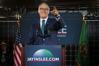 caption: Governor Jay Inslee points to the crowd after announcing his candidacy for President on Friday, March 1, 2019, at A&R Solar on Martin Luther King Jr. Way in Seattle. 