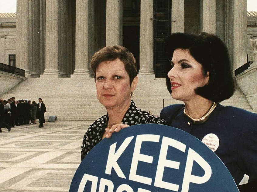 caption: This April 26, 1989 file photo shows Norma McCorvey (L), known as "Jane Roe" in the 1973 landmark Roe vs Wade ruling, with attorney Gloria Allred (R) in front of the US Supreme Court building.