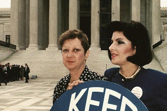 caption: This April 26, 1989 file photo shows Norma McCorvey (L), known as "Jane Roe" in the 1973 landmark Roe vs Wade ruling, with attorney Gloria Allred (R) in front of the US Supreme Court building.