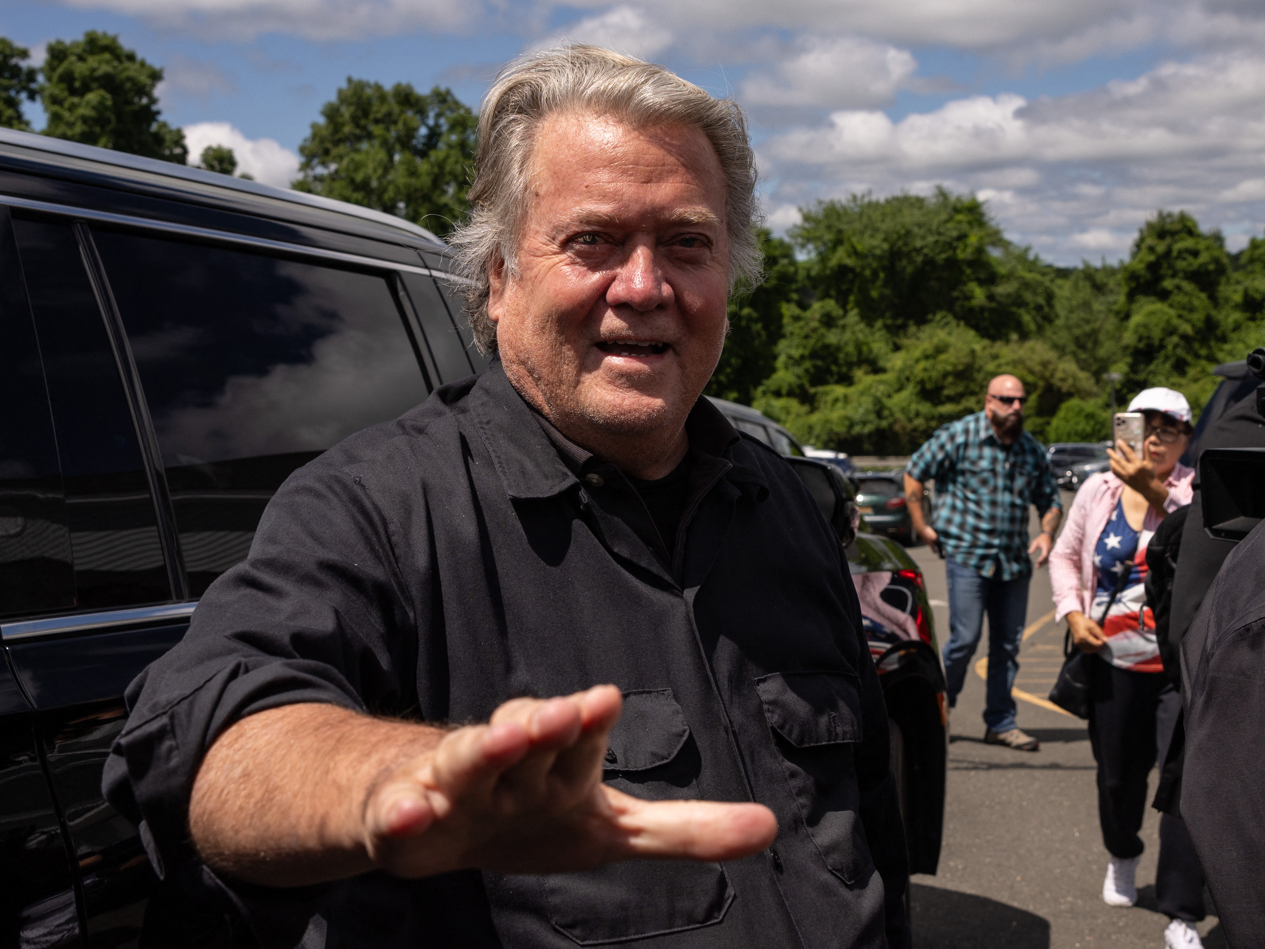 caption: Former White House chief strategist Steve Bannon arrives at a press conference outside a federal correctional institution on July 1, 2024 in Danbury, Conn.
