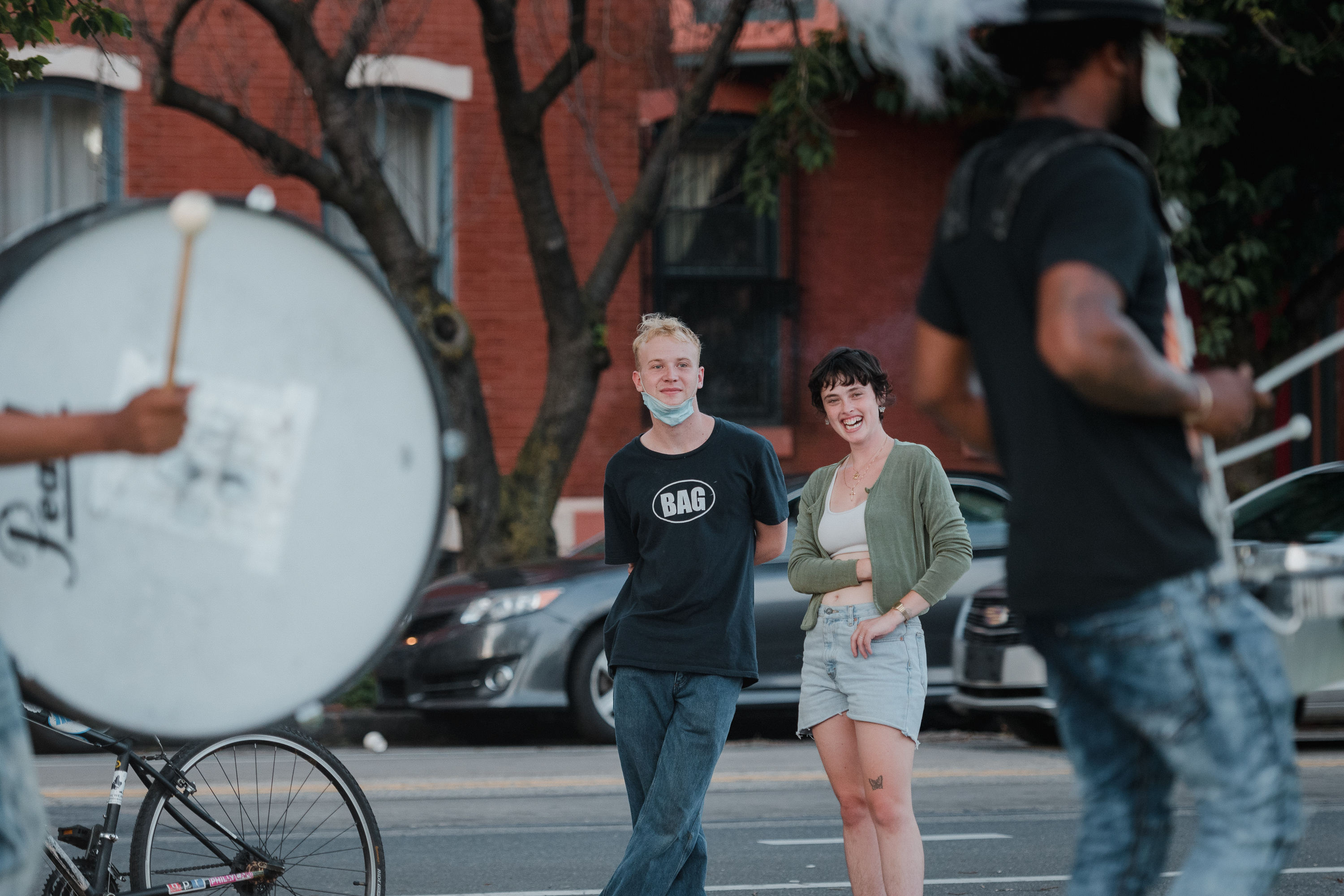 caption: Nat Hilton (left) and Jessica Harmon came out to see the drumline and drill team in West Philadelphia.