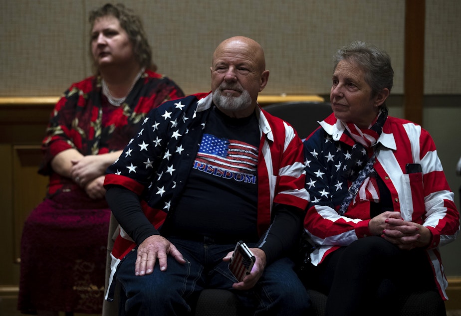caption: David and Linda Huck wait for election night results while attending a Republican Party election night gathering on Tuesday, November 8, 2022, at the Hyatt in Bellevue. 