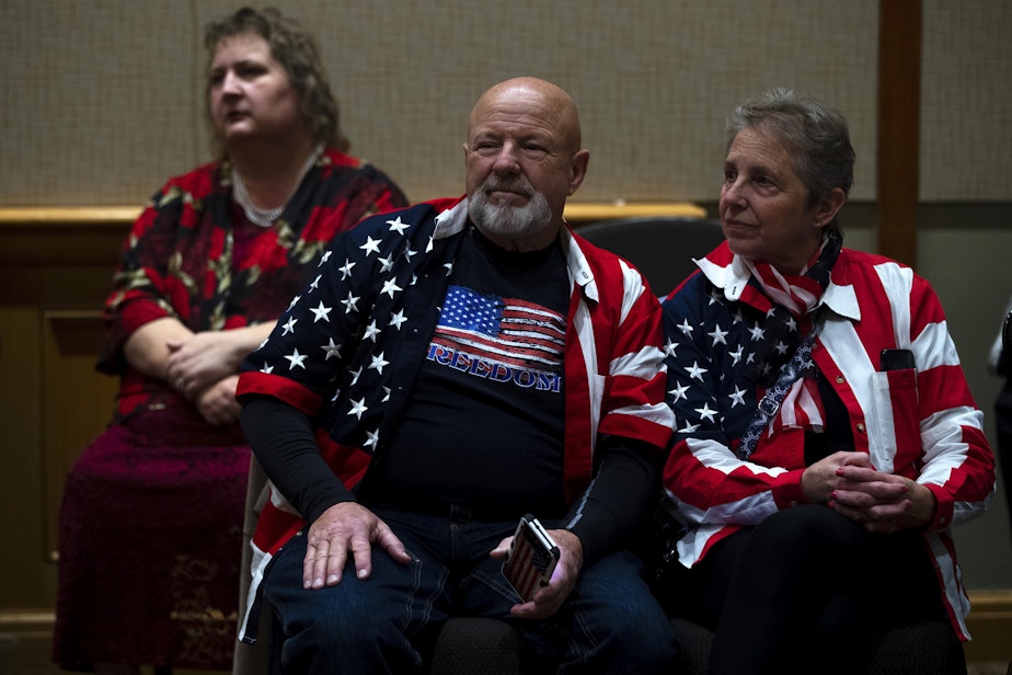 caption: David and Linda Huck wait for election night results while attending a Republican Party election night gathering on Tuesday, November 8, 2022, at the Hyatt in Bellevue. 