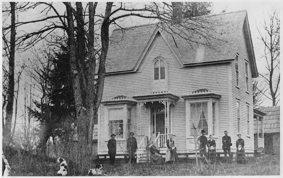 caption: There are no known photos taken of George Bush, one of the founders of Tumwater. This photo is of his children with Isabella, a German-American woman, in front of the house they built in Bush Prairie. 
