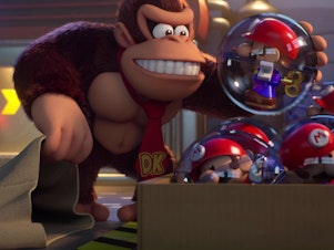 caption: Donkey Kong, possessed by a consumerist frenzy for Mini-Mario toys.