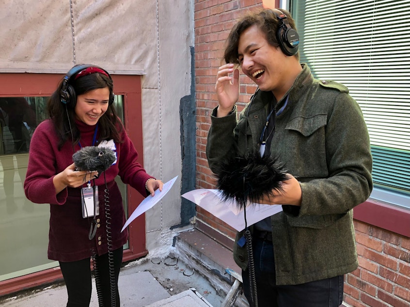 caption: Kea Lani Diamond and Hayden Andersen record sound during an audio scavenger hunt at KUOW on October 8, 2022.