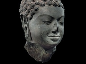 caption: Head of Buddha from the seventh century