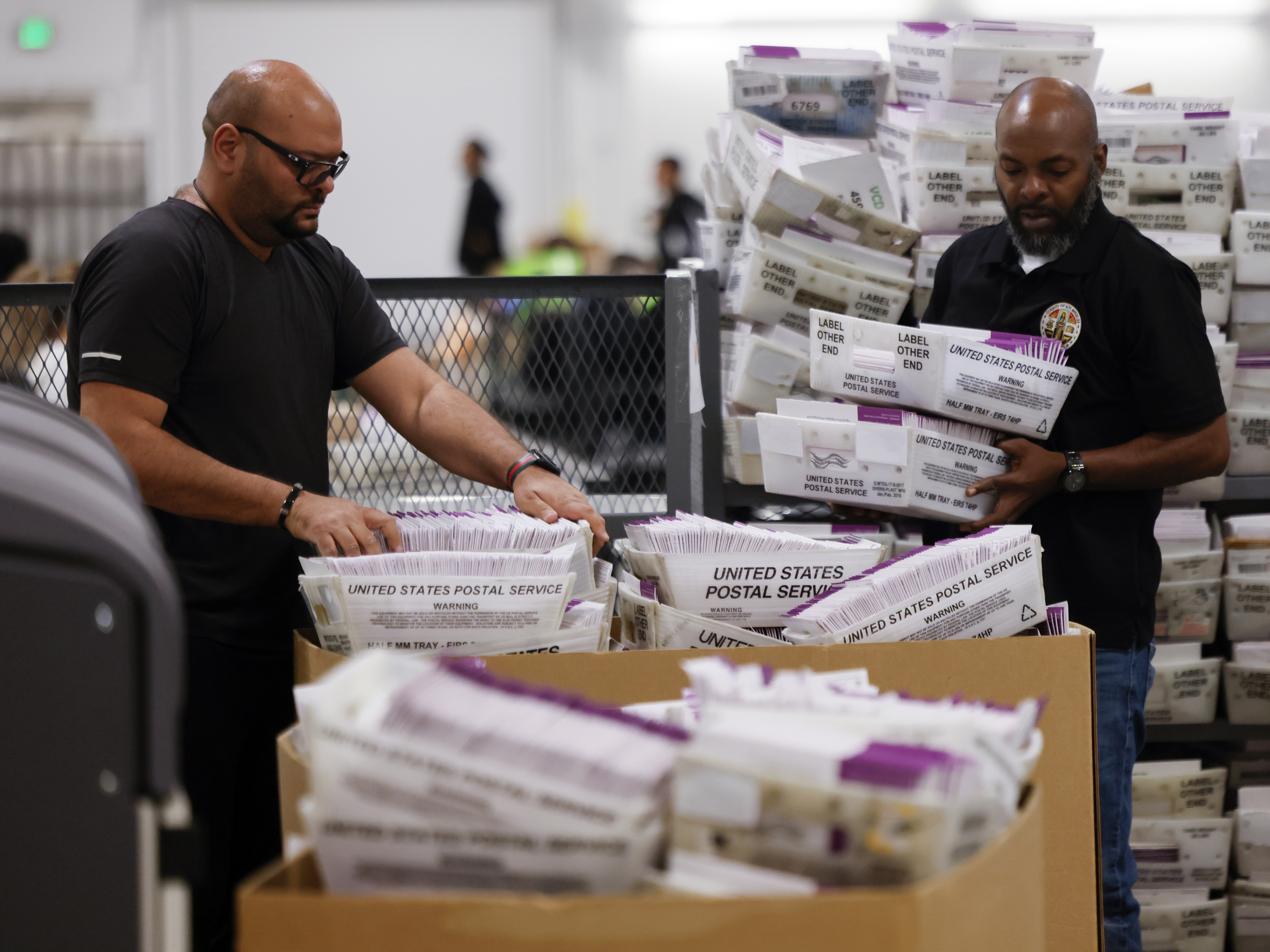 caption: Employees sort ballots in Los Angeles County on Election Day, Nov. 5, 2024. California regularly takes weeks to count all of its general election ballots.