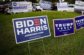 caption: Campaign signs are in abundance last week for early voting at Westchester Regional Library in Miami.