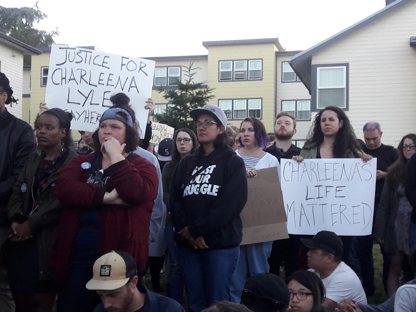 caption: Dozens gathered for a vigil held for a woman shot by Seattle Police