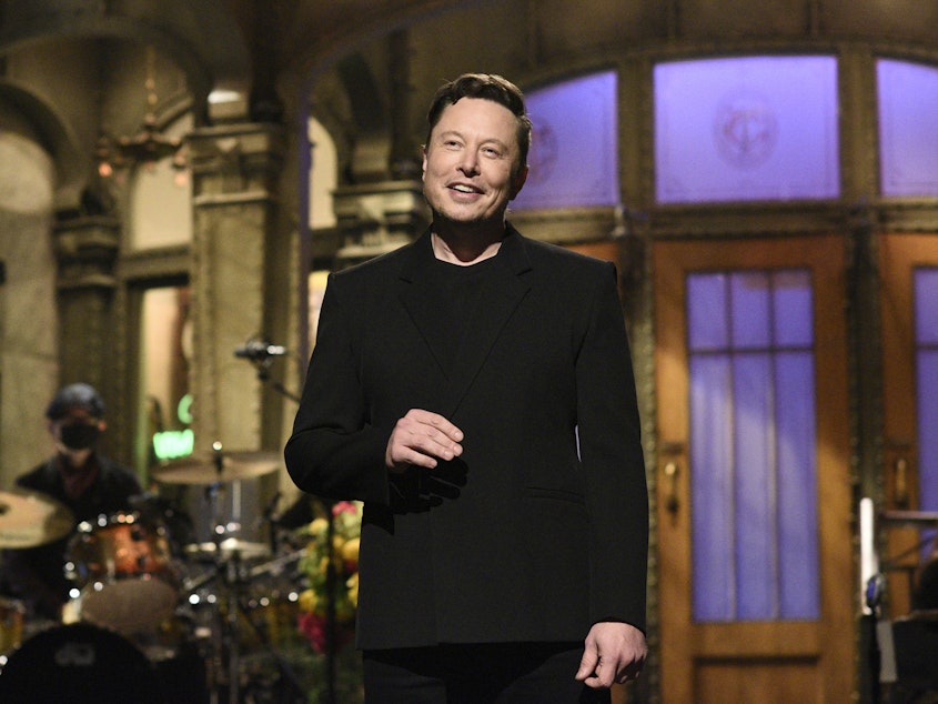 caption: Tesla CEO Elon Musk delivers his opening monologue on "Saturday Night Live" last week in an image released by NBC. Musk tweeted on Wednesday that Tesla would no longer accept cryptocurrency Bitcoin for car purchases.