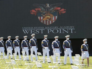 caption: West Point graduating cadets are seen during commencement ceremonies at Plain Parade Field at the United States Military Academy on June 13, 2020, in West Point, N.Y.