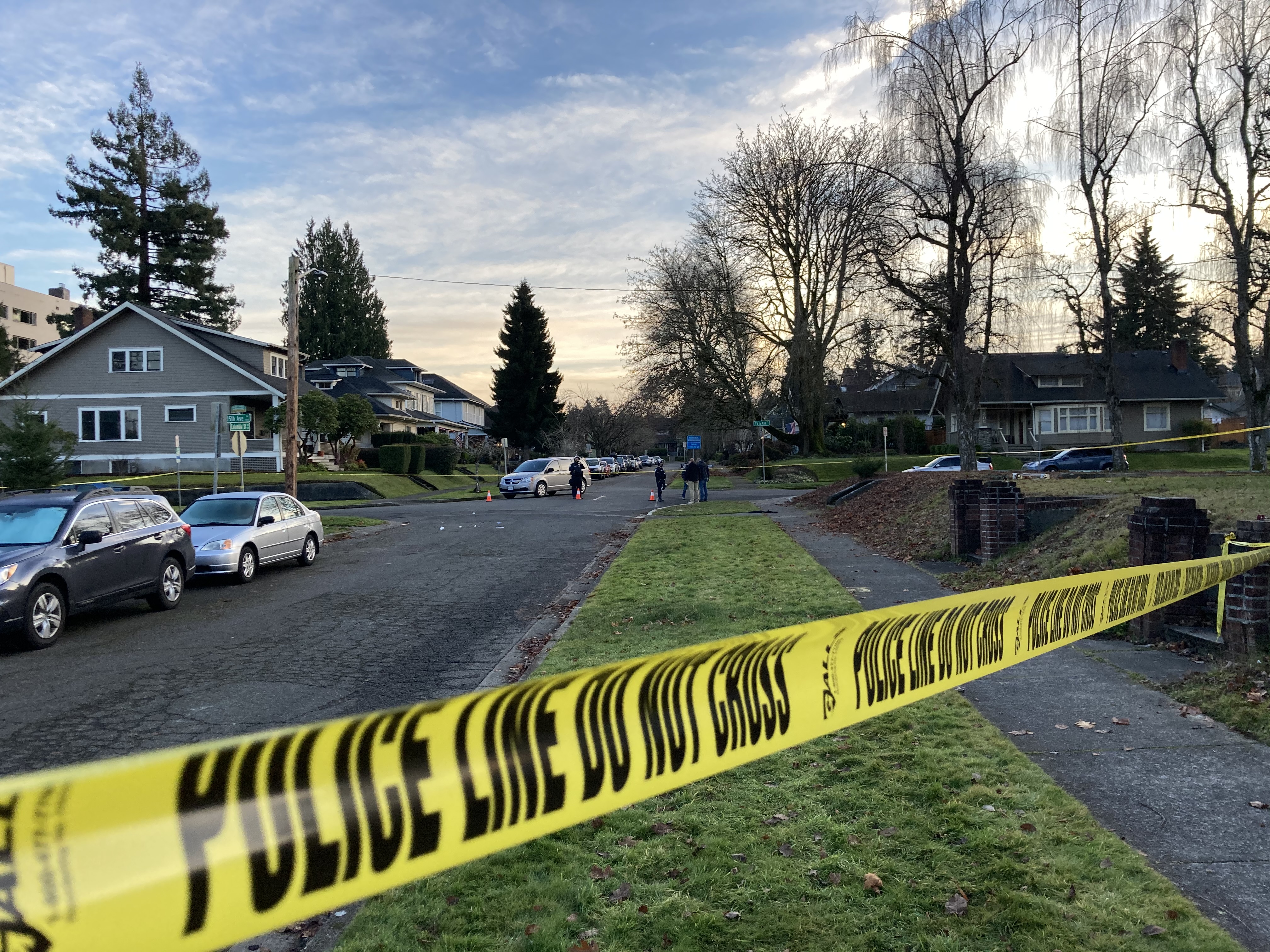 caption: Police tape blocks a street near Washington's Capitol Campus where a person was shot Saturday as far right and far left protesters clashed.