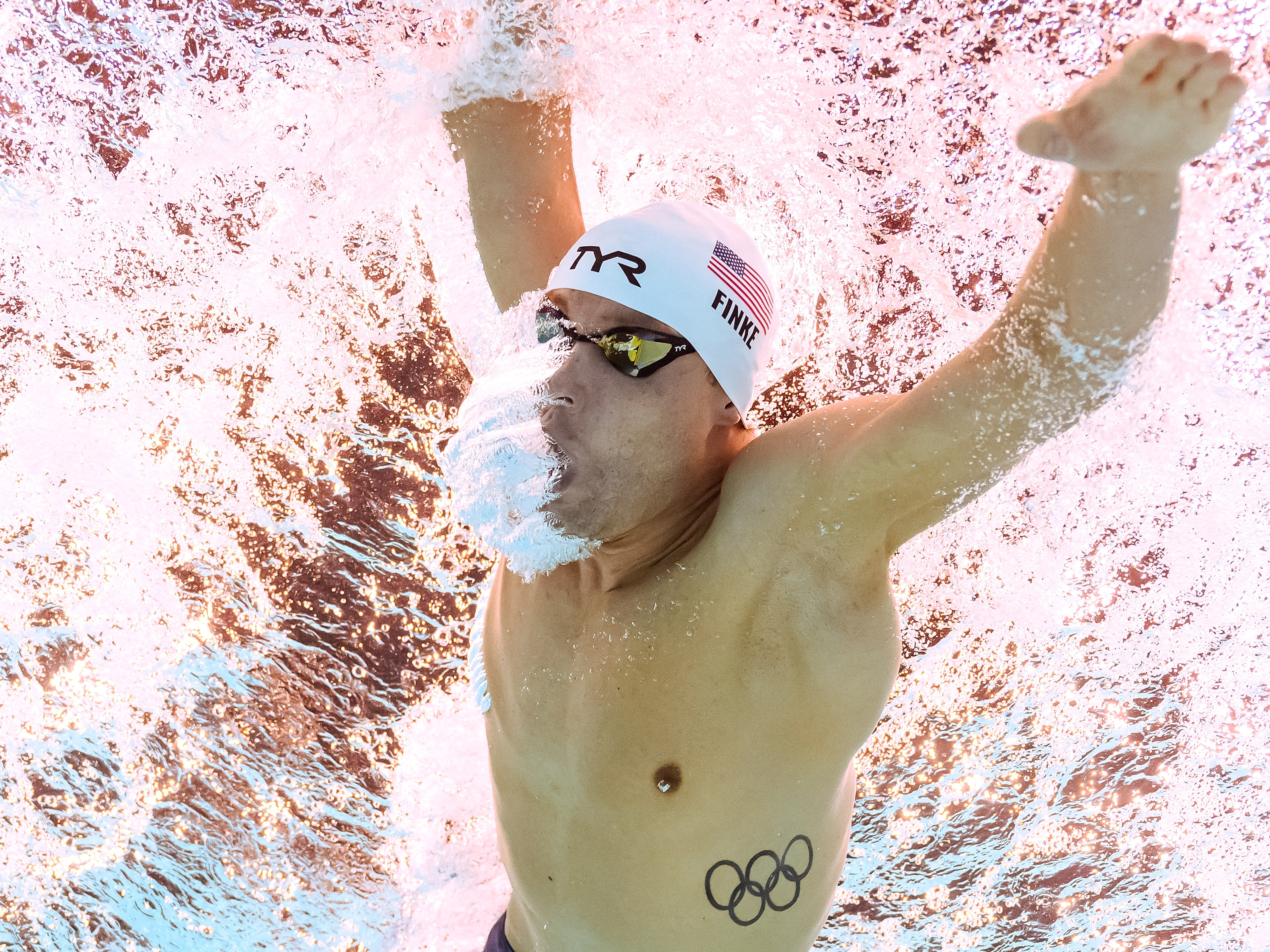 caption: The USA's Bobby Finke won the 1,500-meter freestyle final at the Paris Olympics Sunday night, shattering a world record in the endurance race that had stood since 2012.