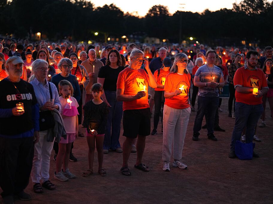 caption: Community members gathered in Minneapolis for a candlelight vigil to honor the victims and survivors of the shooting at Annunciation Catholic School in Minneapolis Wednesday, August 27, 2025.