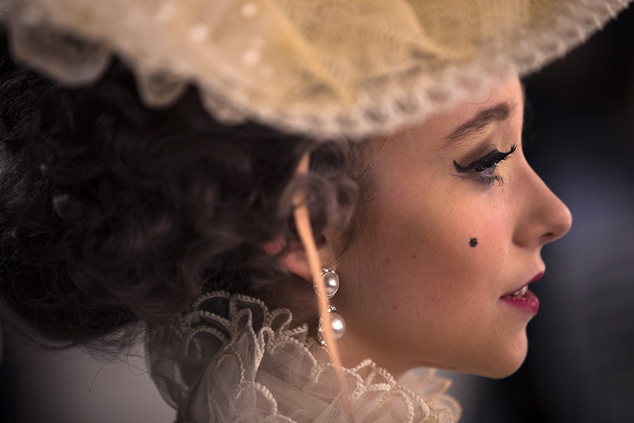 caption: Pacific Northwest Ballet student Elaine Rand sits in the hair and makeup area between acts of Cinderella on Saturday, February 1, 2020, at McCaw Hall in Seattle.