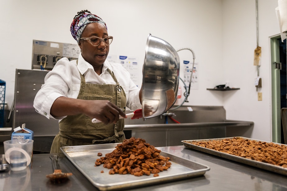 caption: MariChris Brown preparing candied pecans in Tukwila. The pecans are stirred every 15 minutes to avoid burning.  