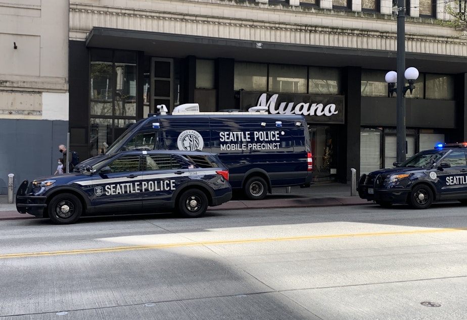 caption: The Seattle Police Department's mobile precinct sits downtown near 3rd Avenue and Pine Street on Thursday.