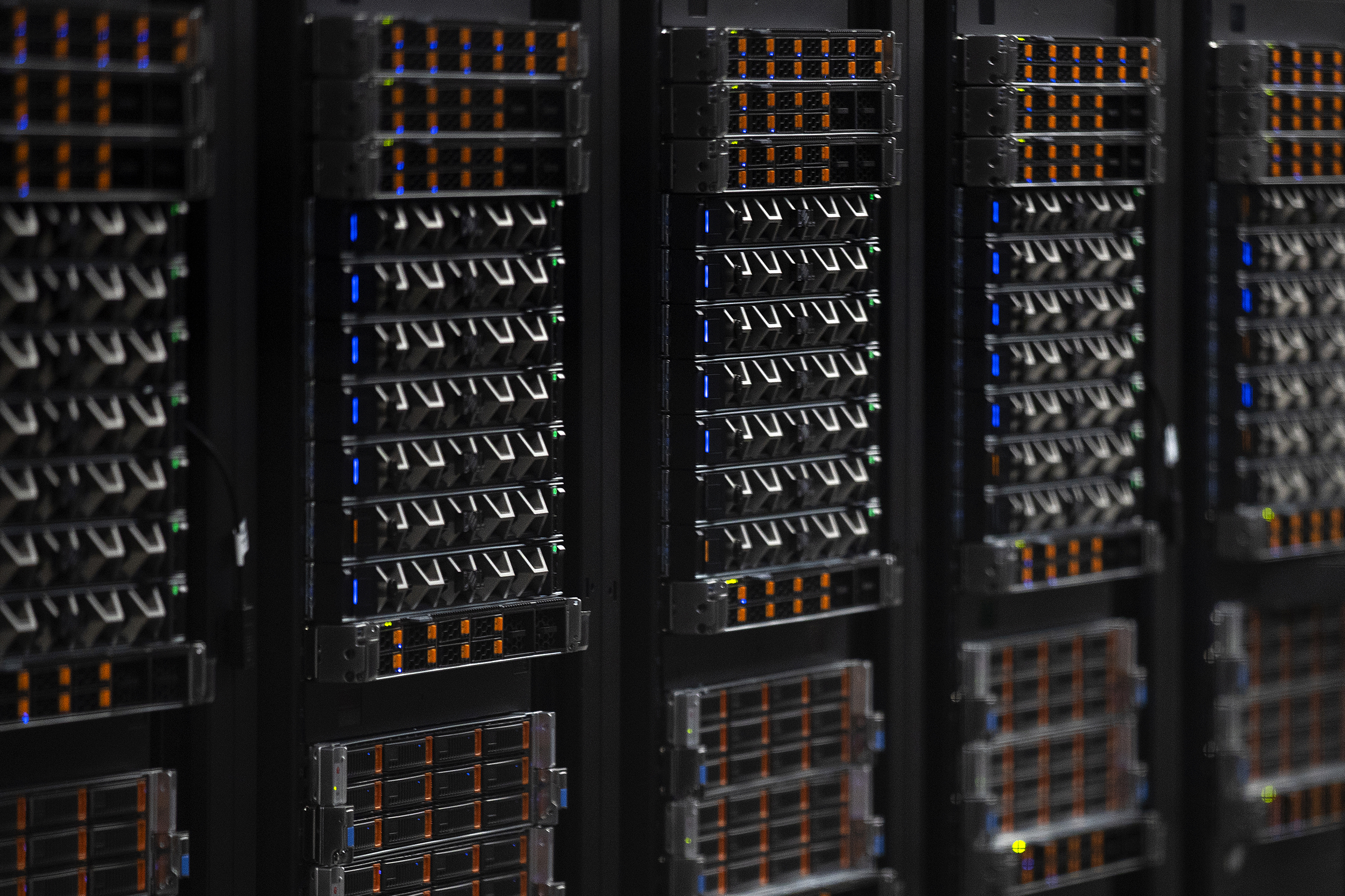 caption: Rows of servers are shown at the Sabey data center on Thursday, July 17, 2025, in Quincy, Washington. 