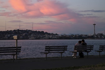 caption: The sun sets on Thursday, June 29, 2023, as seen from Alki Ave Southwest in Seattle. 