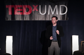Dylan Selterman on the TEDx stage.