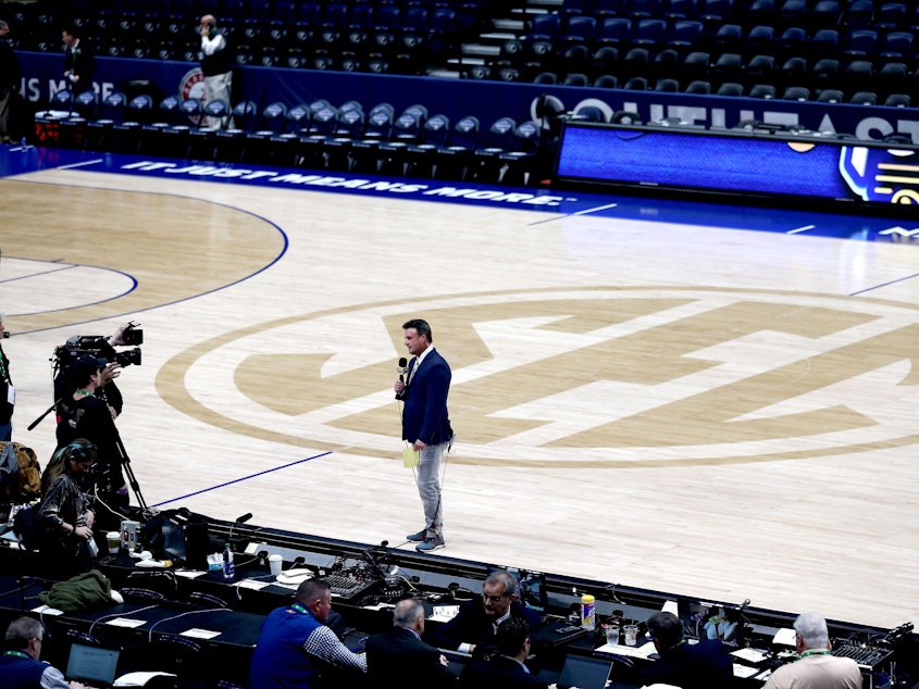 caption: ESPN's Karl Ravech reports on the cancellation of the SEC Men's Basketball Tournament on March 12, in Nashville. With no live sports to show, the network is scrambling to fill the time. Its offerings now include diversions like cherry pit spitting and marble racing.