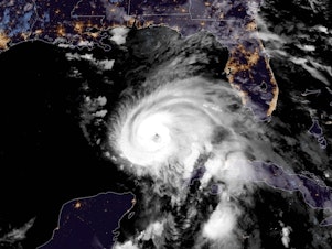 caption: A satellite image shows Hurricane Michael moving north in the Gulf of Mexico, heading for a landfall in the Florida Panhandle.