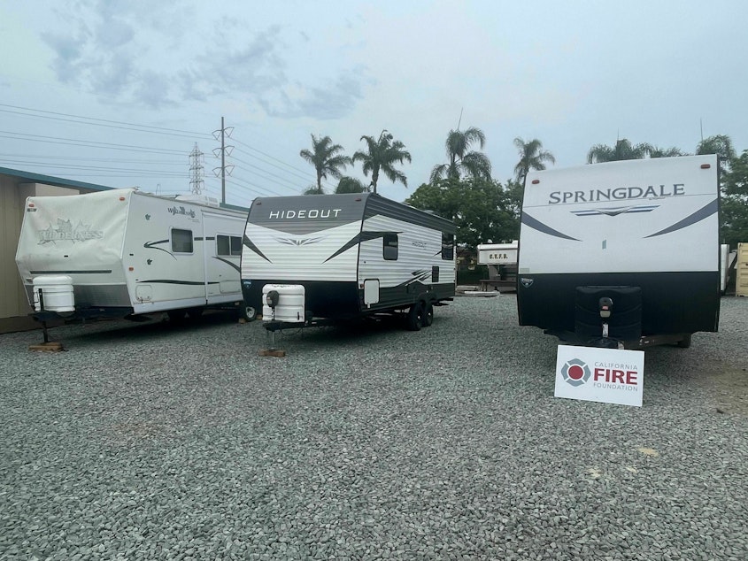 caption: Three RVs ready to be shipped to families in Maui.