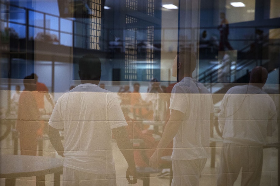 caption: Male detainees are shown in one of the housing units on Tuesday, September 10, 2019, at the Northwest Detention Center, renamed the Northwest ICE Processing Center, in Tacoma.