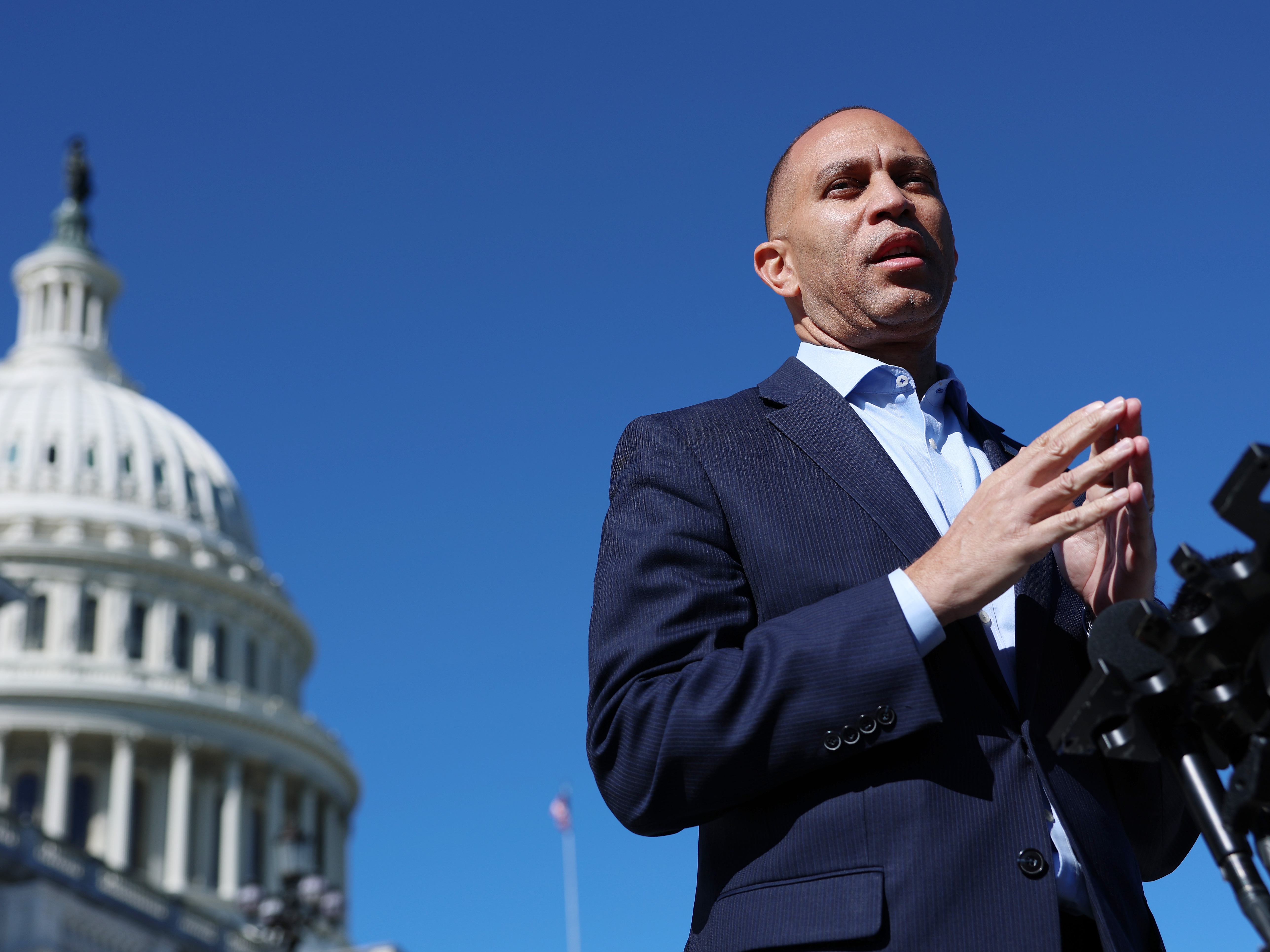 caption: House Minority Leader Hakeem Jeffries, D-N.Y., speaks to reporters outside of the U.S. Capitol on Oct.16, 2025.