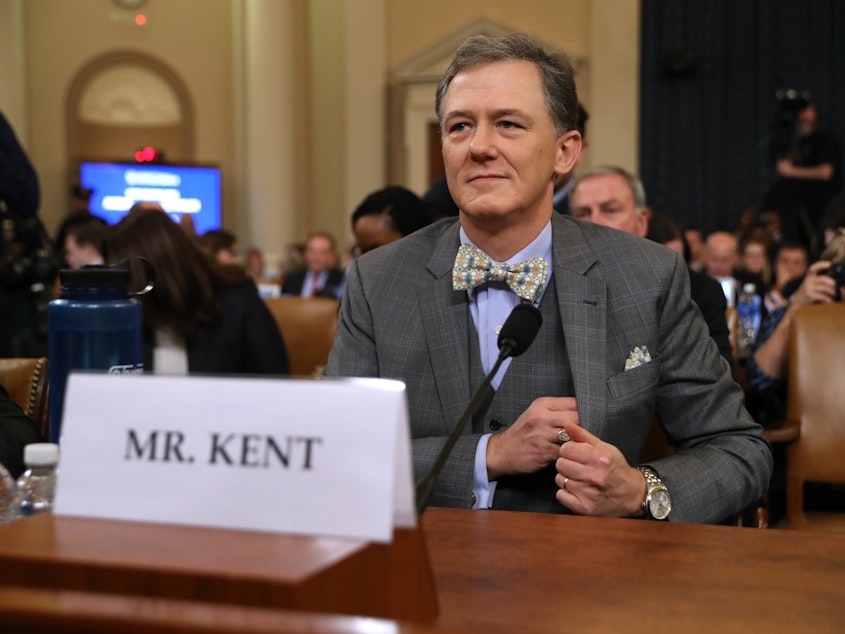 caption: Deputy Assistant Secretary for European and Eurasian Affairs George Kent waits to testify before the House Intelligence Committee on Capitol Hill on Wednesday.