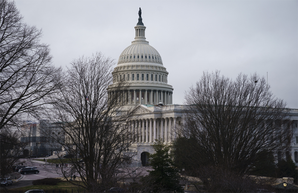 caption: The Capitol is seen before the resumption of the impeachment trial of President Donald Trump on charges of abuse of power and obstruction of Congress, in Washington, Friday, Jan. 24, 2020. 