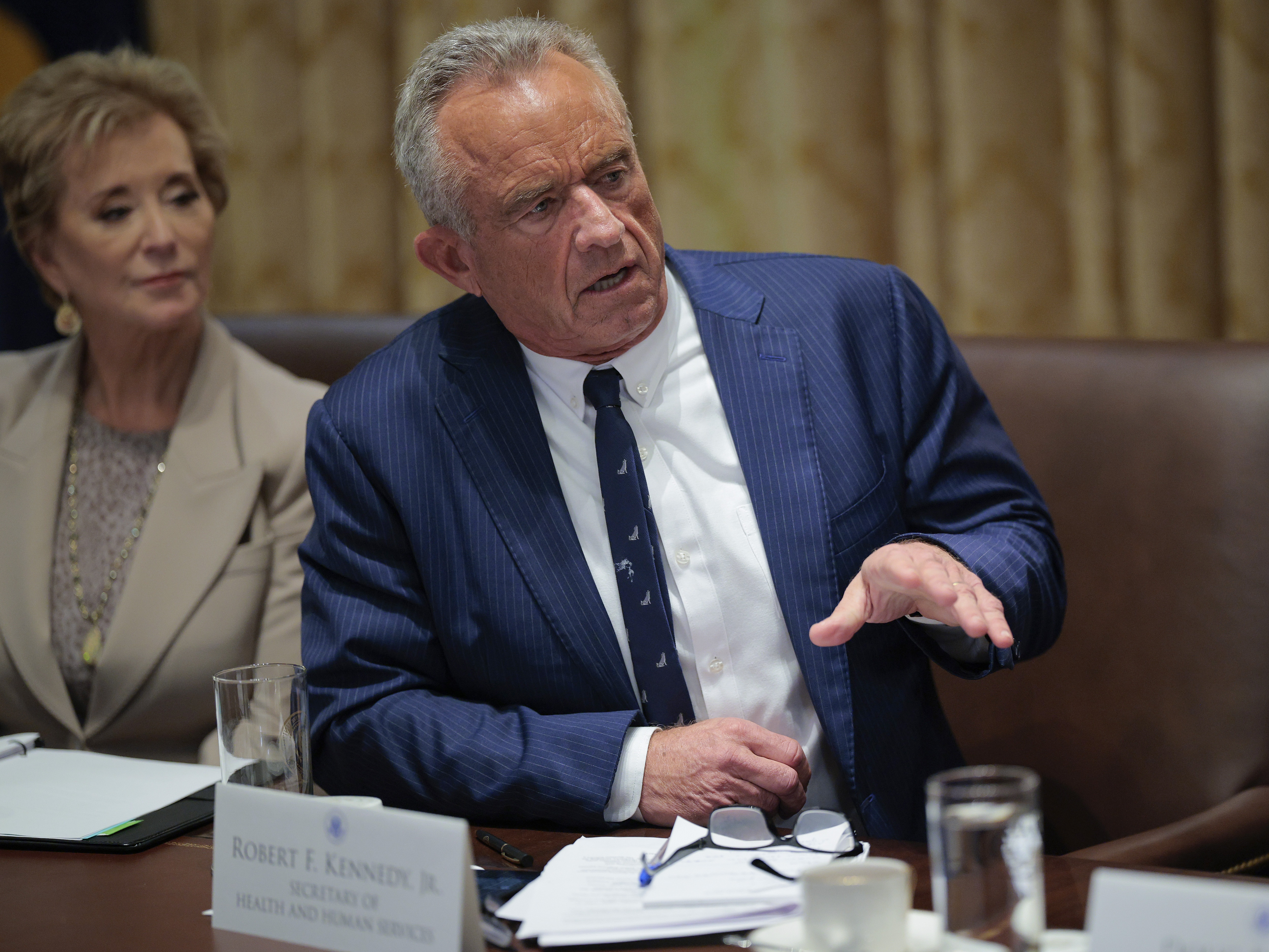 caption: Health Secretary Robert F. Kennedy Jr. and Education Secretary Linda McMahon generally sit next to each other during President Trump's cabinet meetings, as at this one on Aug. 26.