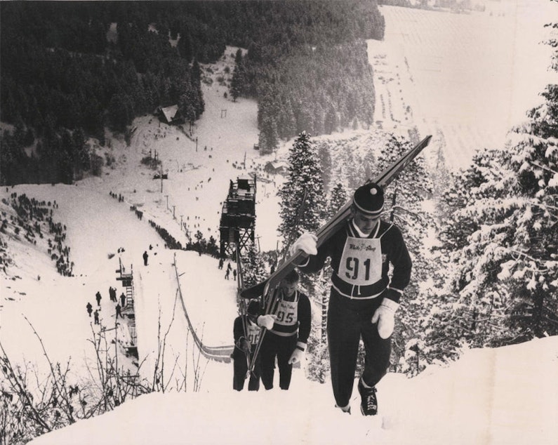 caption: In the heyday of ski jumping at the Leavenworth Ski Hill, competitors climbed a walkway to the top of the large ski jump.