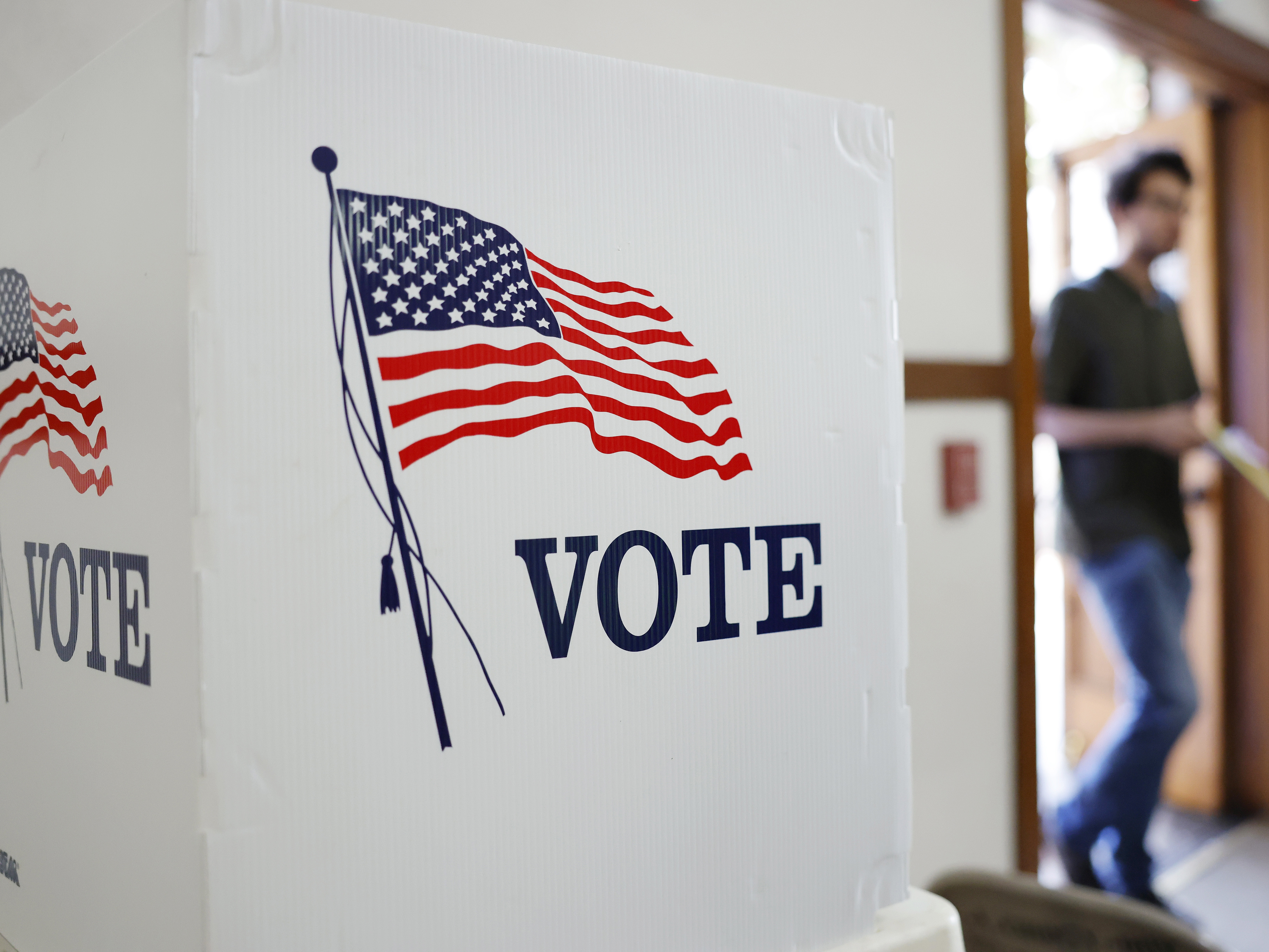 caption: A person enters a polling station to vote on Nov. 4, 2025, at First United Methodist Church in Pasadena, Calif.