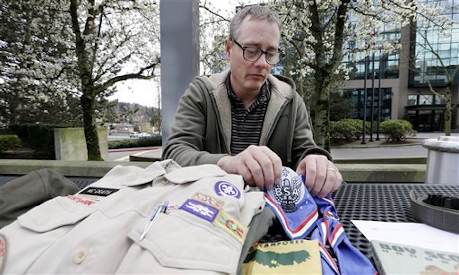 caption: The Boys Scouts of America has revoked the charter of a Seattle church because it allowed a gay adult, Geoff McGrath, to continue leading a troop. McGrath, pictured here on April 1, 2014, has been leading Seattle Troop 98 since its application was approved last fall.