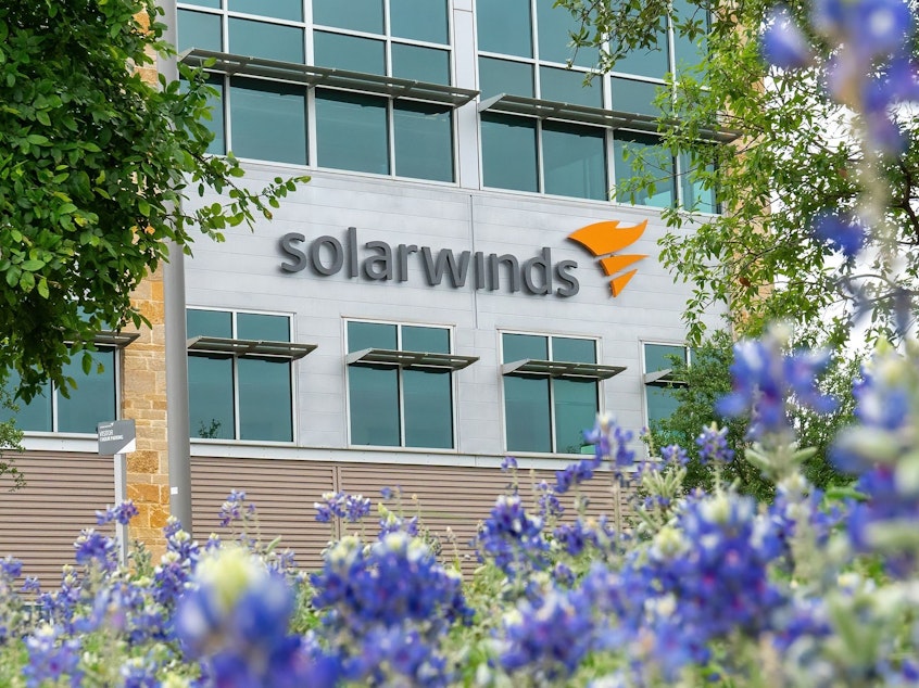 caption: The SolarWinds Corp. logo is seen at the headquarters in Austin, Texas in April.